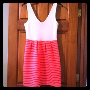 White and neon pink low back dress.